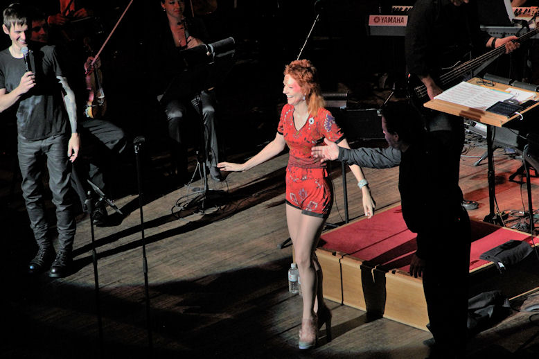 West Village Model Karen Rempel conducting the Vancouver Symphony Orchestra at a David Bowie Memorial Concert in 2016