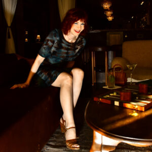 Manhattan model Karen Rempel savors the sparkling speakeasy cocktail vibe in Chelsea Living Room.