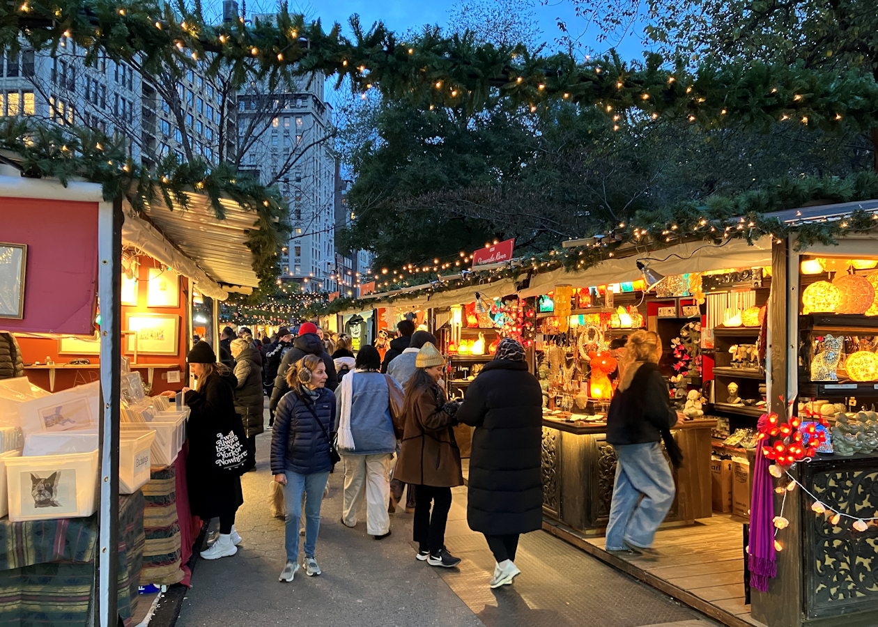 After-work crowds peruse the unique handcrafted gifts at the Union Square Holiday Market.
