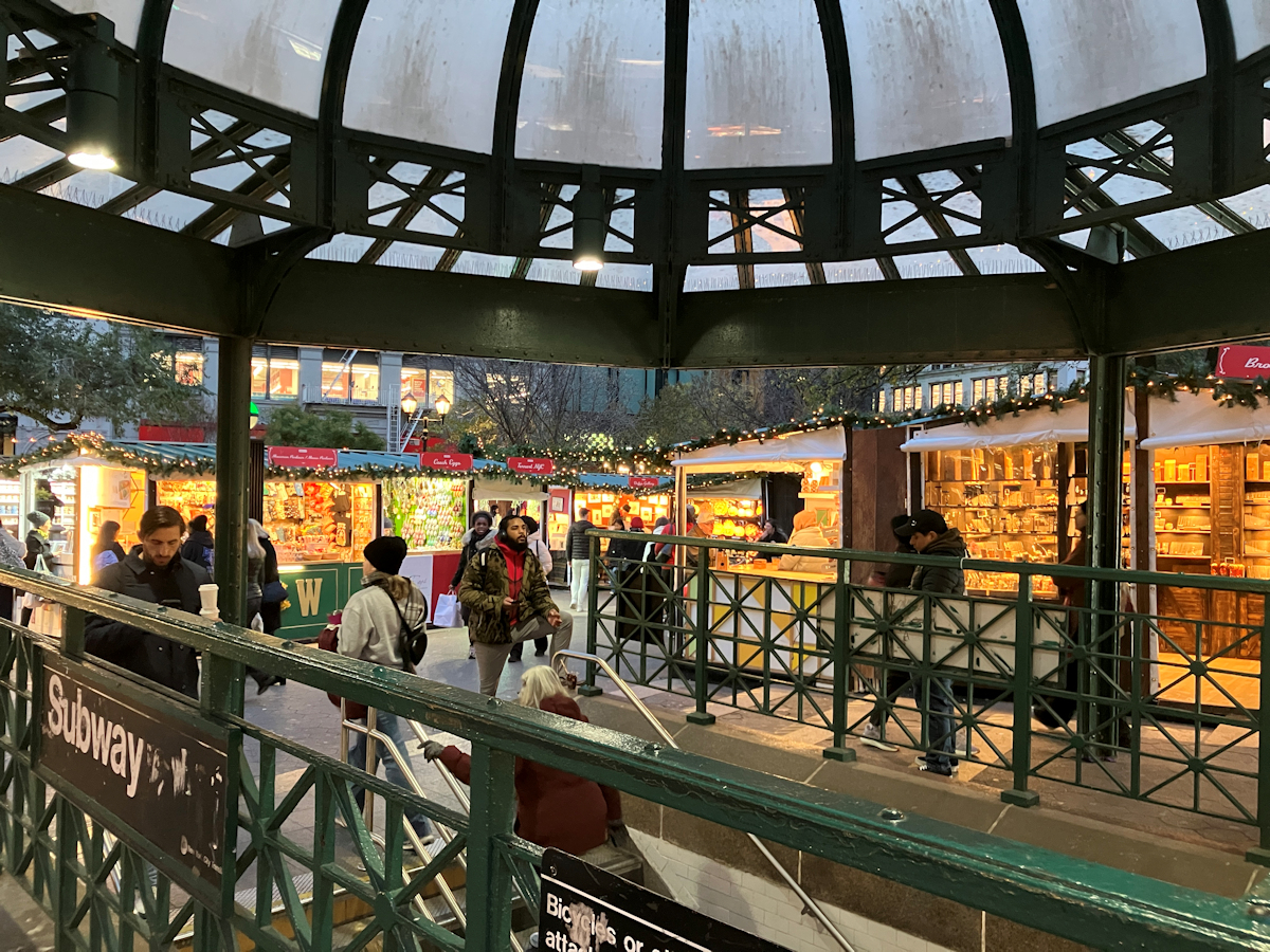 Holiday shoppers emerge from the rotunda of the Union Square subway station into a festive holiday scene. Photo: Karen Rempel