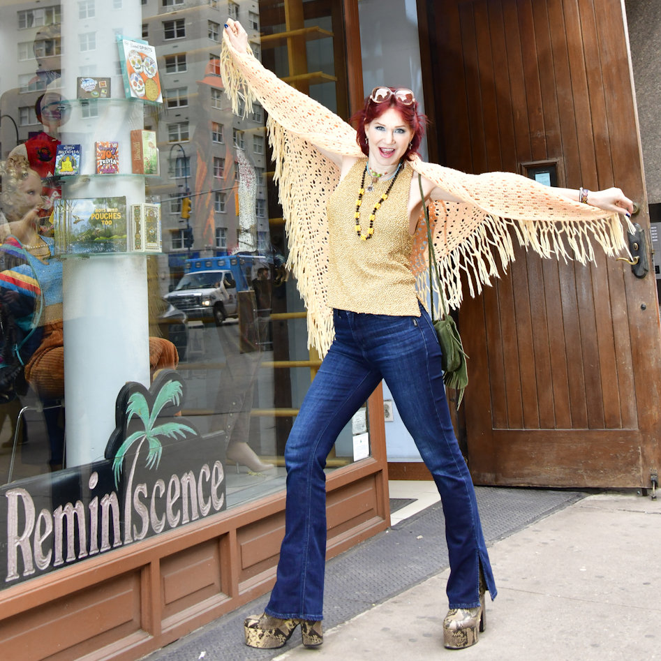 Karen Rempel transforms into a bird wearing hand-crocheted, butter-yellow shawl from Reminiscence.