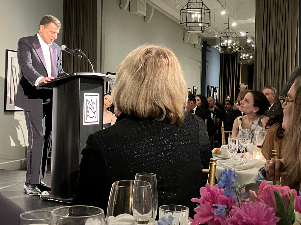 David Remnick addresses an enraptured audience. The elegant Esther Fein, in the white dress third from left, is married to Remnick.