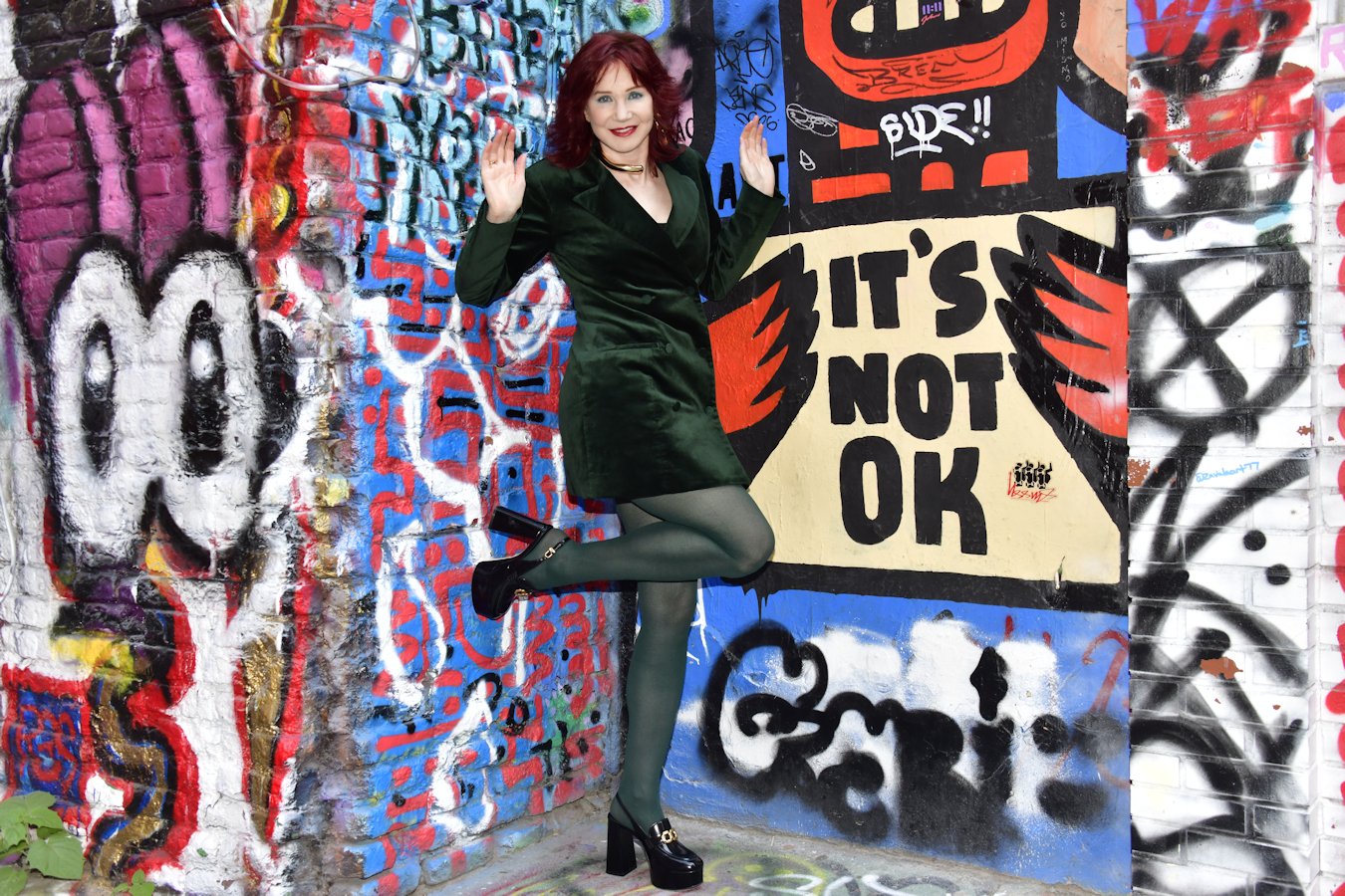 Manhattan model 5.Karen Rempel surrenders to being immersed in graffiti in Freeman Alley.