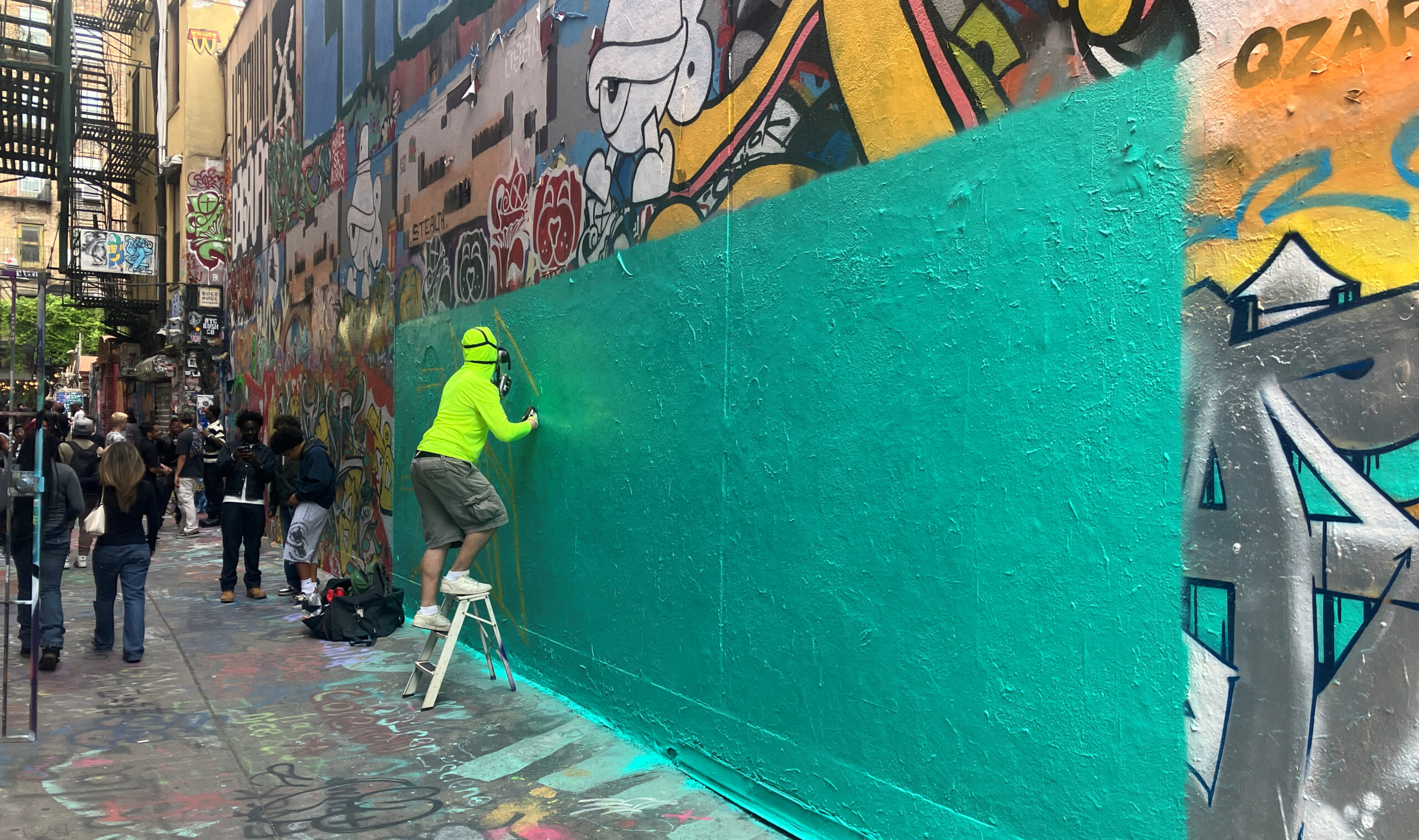 Graffiti artist working in Freeman Alley